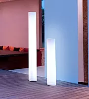 LED floor lamp hire Berlin – battery-powered LED lighting beside sofa