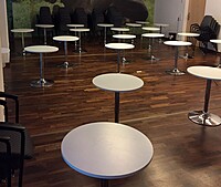 adjustable bar table hire Berlin – wood and chrome adjustable standing table indoors